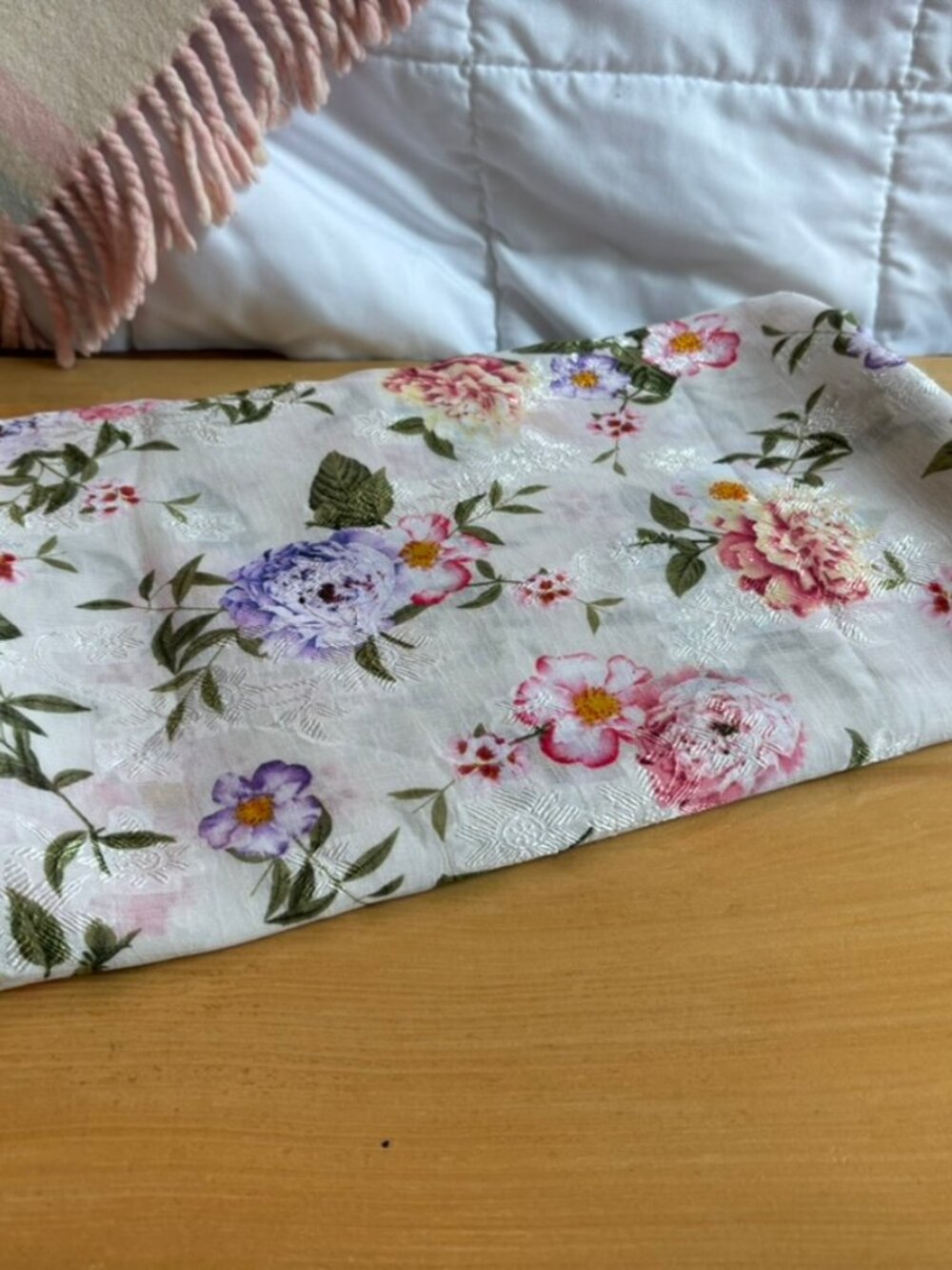 JOANN exclusive white floral silky fabric featuring purple and pink blossoms
